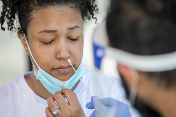 Woman is getting a nasal swab coronavirus test